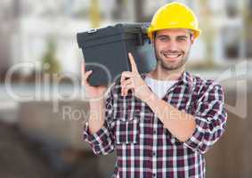 Carpenter with tool box on building site