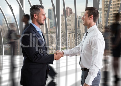 businessmen handshake in the corridor of the office