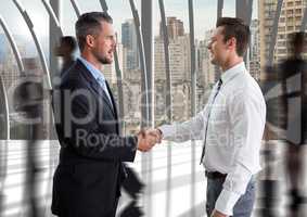 businessmen handshake in the corridor of the office