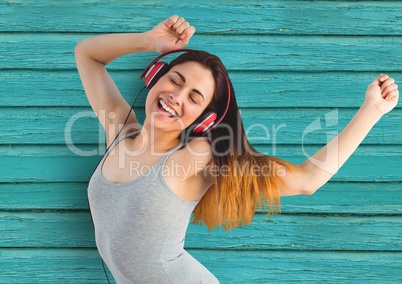 hipster dancing with the musice with light blue wood background