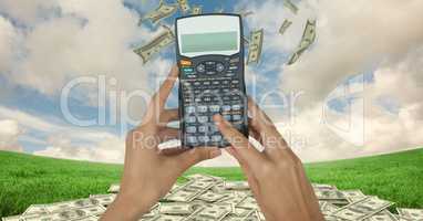 Digital composite image of hands holding calculator with currencies on grassy field against sky