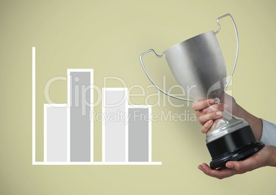 Cropped image of hand holding trophy by graph against beige background