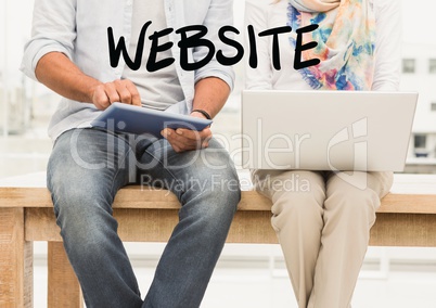 Website text against midsection of couple with laptop and digital tablet