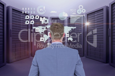 Businessman is standing on from the back against data center background