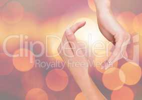 Hands curved posture with sparkling light bokeh background
