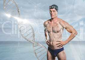 swimmer with silver dna chain in front of the sea
