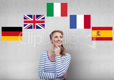 main language flags around young happy woman thinking.