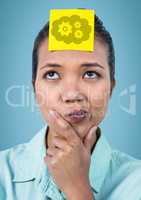 Woman thinking with yellow sticky note on head showing cloud and gear graphic against blue backgroun