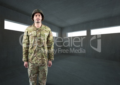 soldier with helmet in dark concrete room