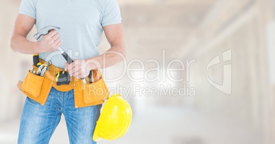 Carpenter  with tools on building site