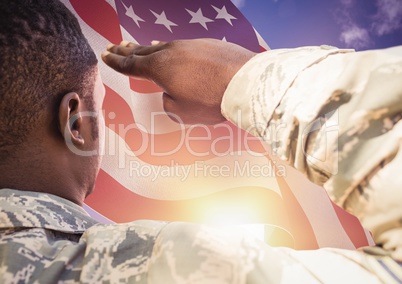 soldier in front of usa flag saluting