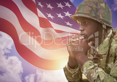 soldier in front of usa flag thinking
