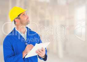 Construction Worker with pen chart in front of construction site