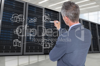 Businessman drawing in a data center