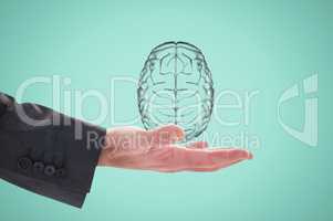 Hand holding a digital brain with green background