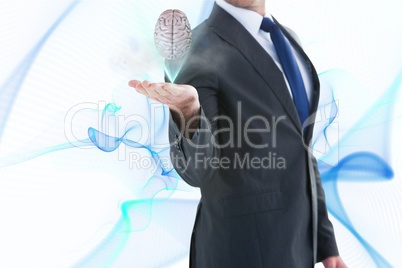 Brain on businessman hands