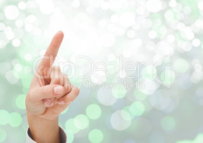 Hand pointing with sparkling light bokeh background