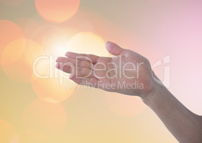 Hand posture with sparkling light bokeh background