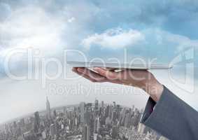 Businesswoman holding tablet over round city
