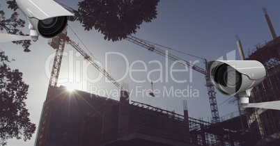 2 CCTV and a construction in front of a sunset