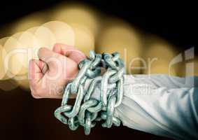 Hands in chains with sparkling light bokeh background