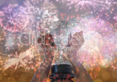 business hand with trophy, gold background and fireworks