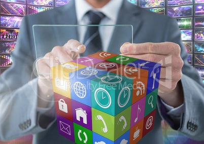 Businessman holding glass screen with apps with colorful screens visuals