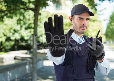 Security man outside street with trees