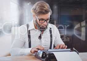 Hipster  man on typewriter blurred room