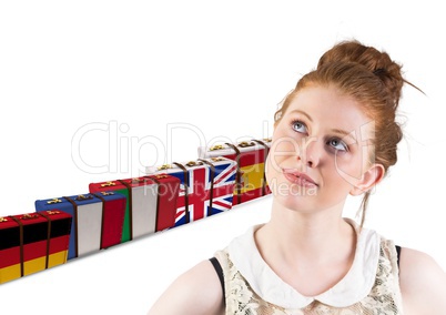 main language flags suitcases behind young happy woman