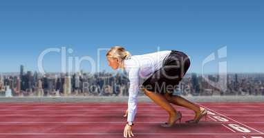 Digital composite image of businesswoman on starting line of race tracks in city against sky