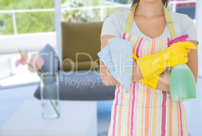 Cleaner with crossed arms in living room