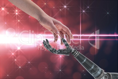 Human and robot touching their hands in red background