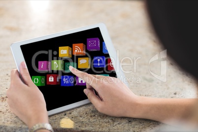 Close up of hands using tablet with graphics on screen