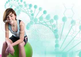 sporty woman sitting on a ball with blue dna chain