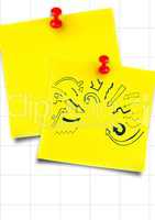 Yellow sticky notes with blue arrow doodles against white graph paper