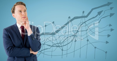 Business man thinking against blue background and blue graph