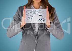 Business woman mid section with card showing blue arrow doodles against blue background