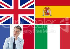 main language flags around young businessman thinking