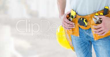 Carpenter with tools on building site