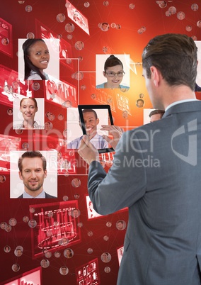 Businessman working on his tablet in front of organization chart back to the photograph