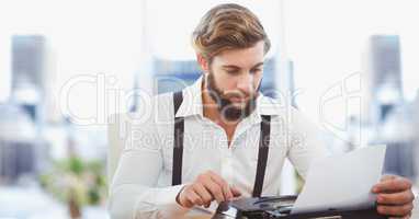 Creative businessman working on laptop in office