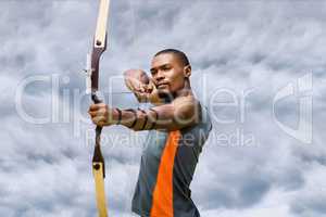 Archery player with a cloudy background