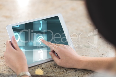 Woman interacting with her tablet