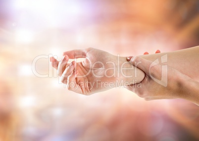 Hand restraining arm with sparkling light bokeh background