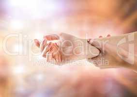 Hand restraining arm with sparkling light bokeh background