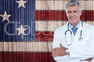 Smiling doctor against american flag