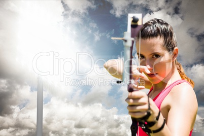 Woman playing archery with cloudy weather