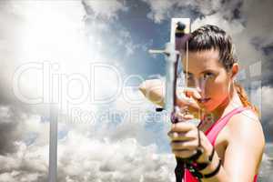 Woman playing archery with cloudy weather