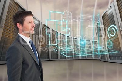 Businessman standing in front of graphics against database background